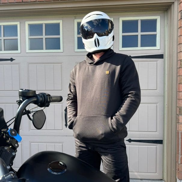 Devan wearing the Defender Motorcycle Hoodie with hands in pocket