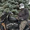 Devan wearing the Defender Motorcycle Hoodie on a Harley Davidson