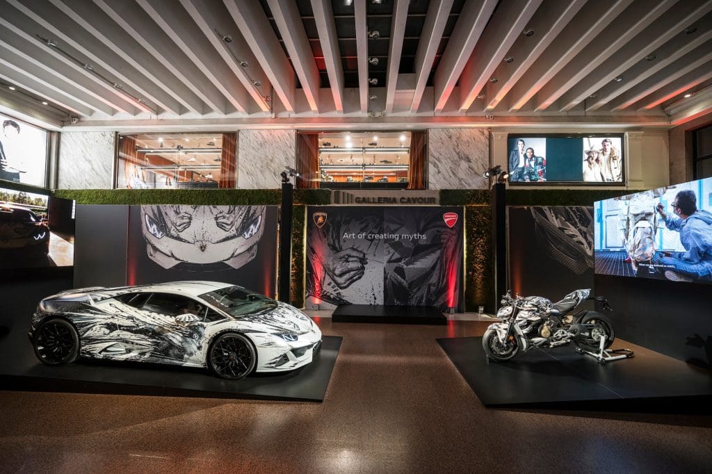 A close up of a customized motorcycle. and supercar.