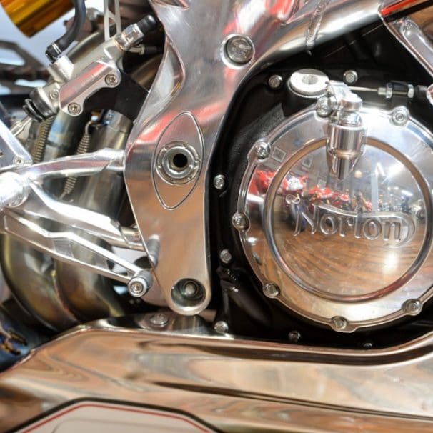 A side view of a chromed motorcycle.