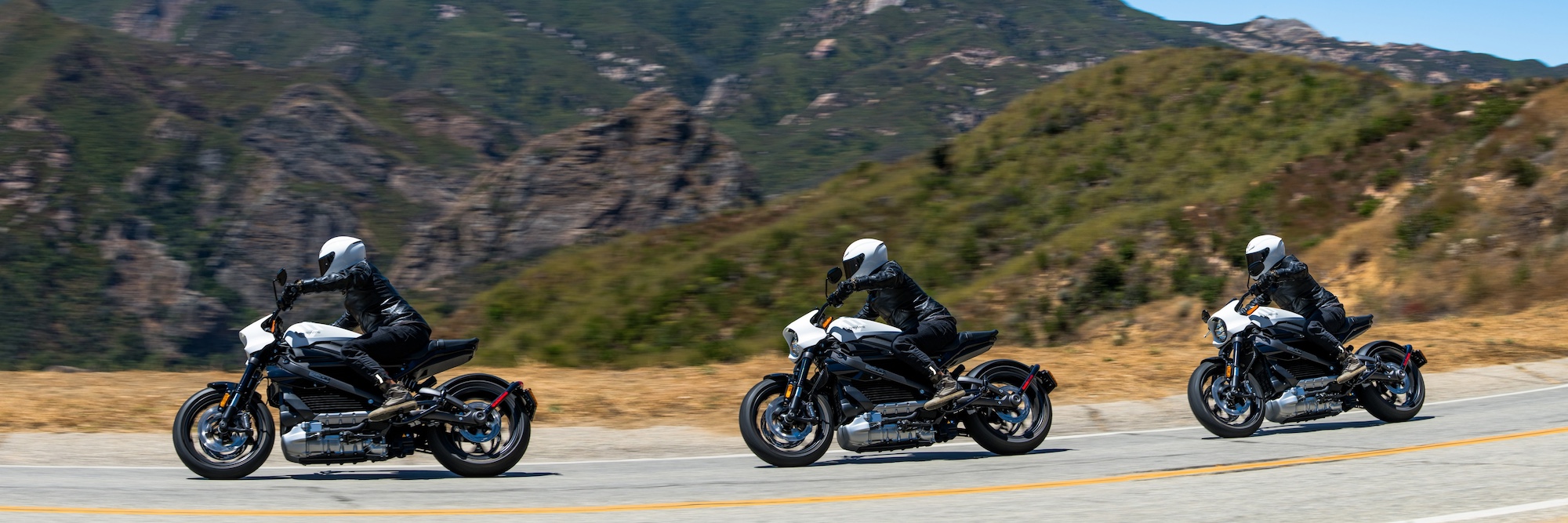 Three motorcyclists on electric motorcycles.