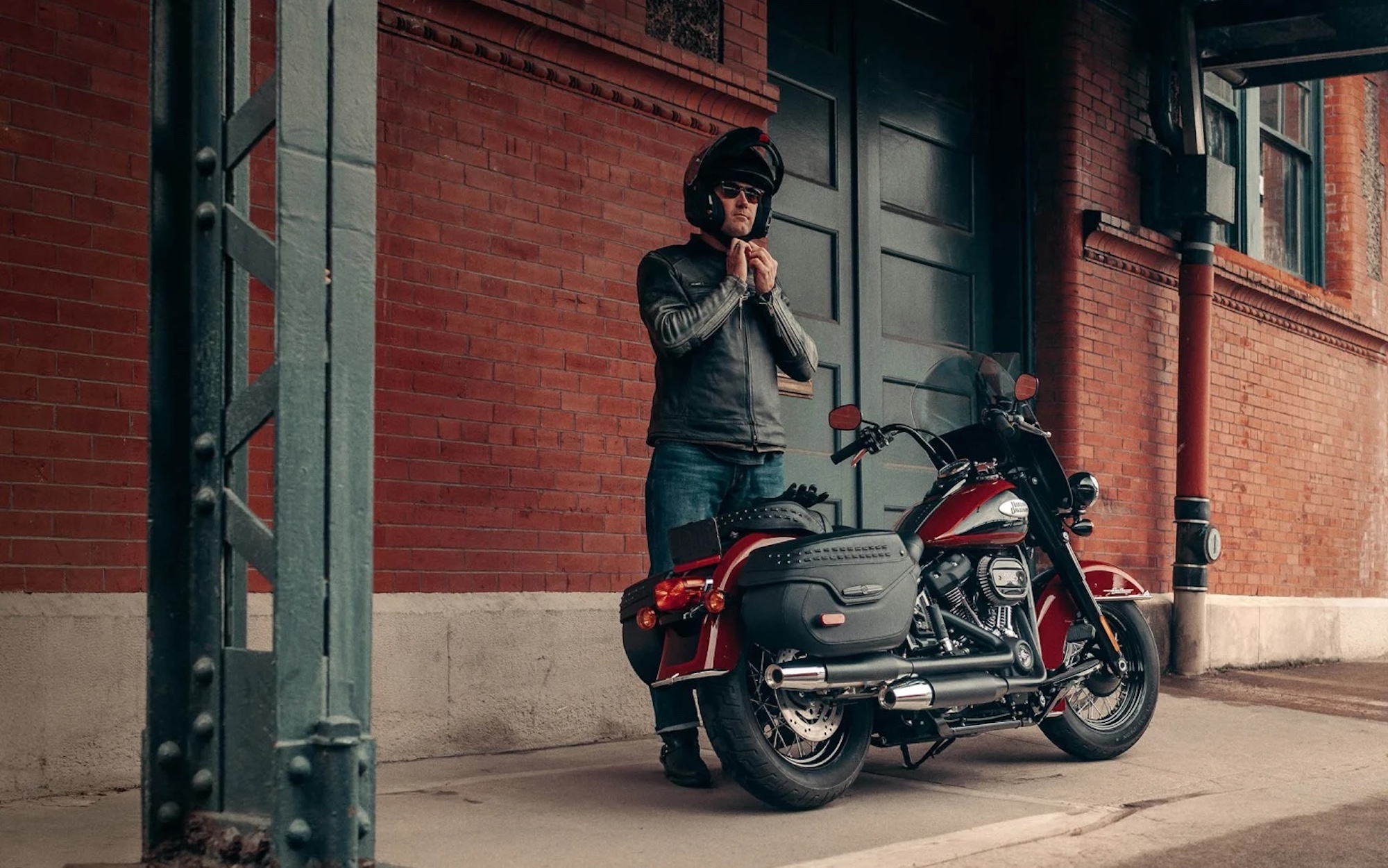 A man behind a motorcycle.