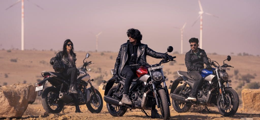 Three riders on motorcycles.