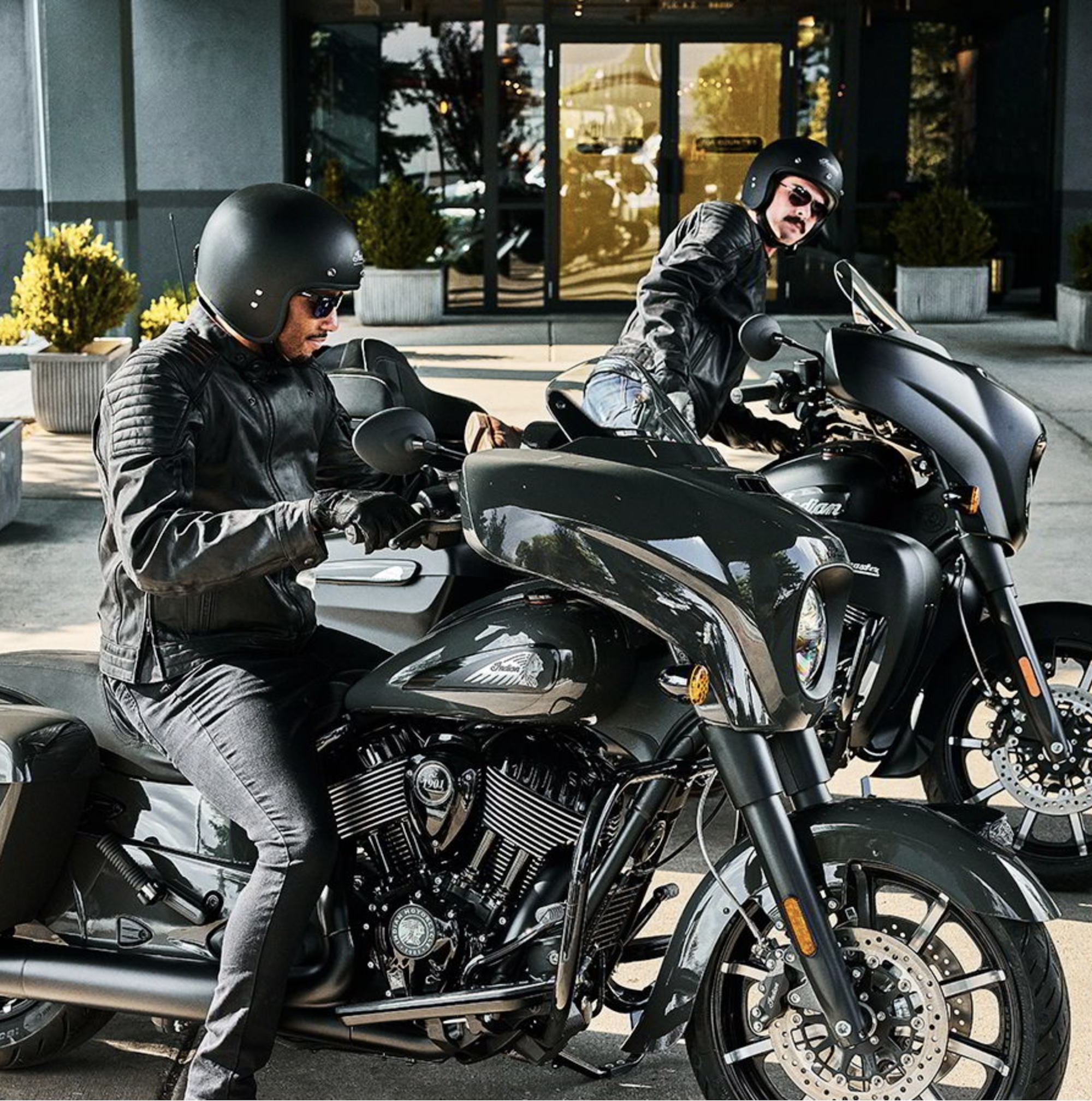 Two riders on Chieftain motorcycles.