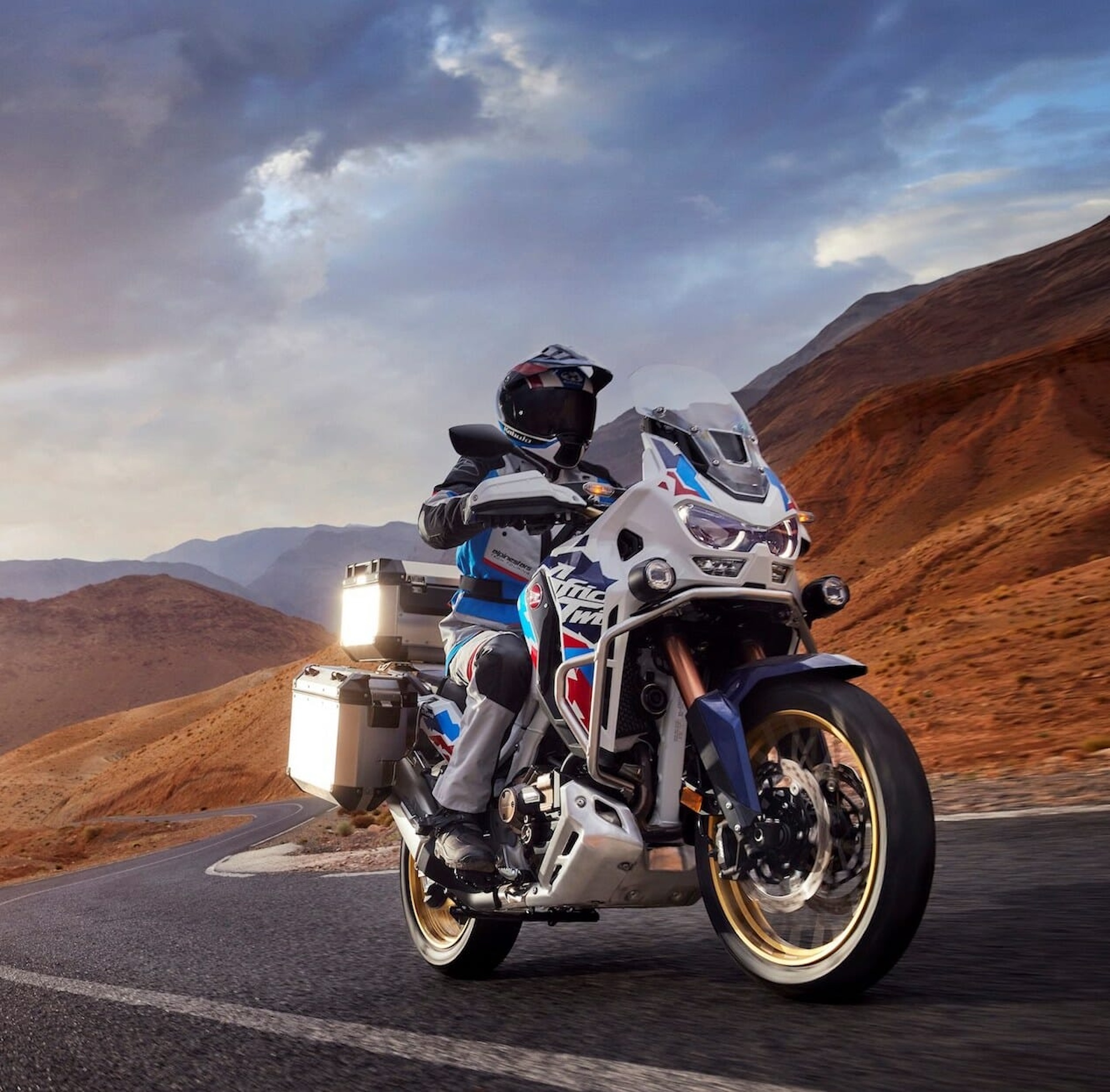 A front quarter view of a rider on an adventure bike.