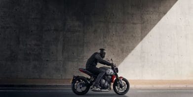 A side view of a motorcyclist.