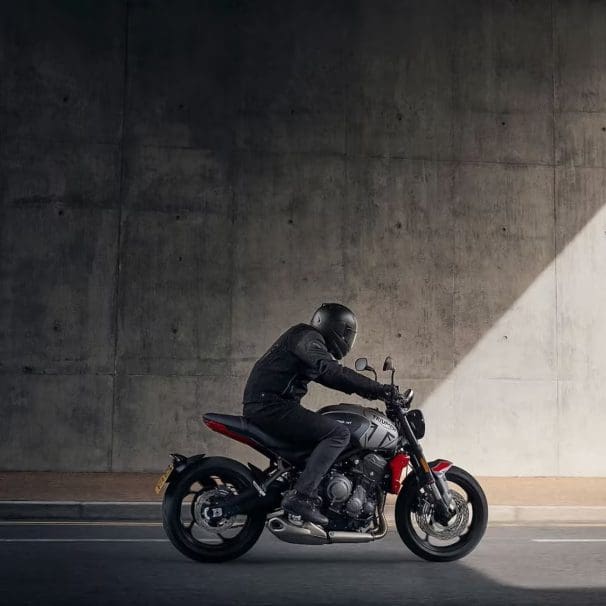 A side view of a motorcyclist.