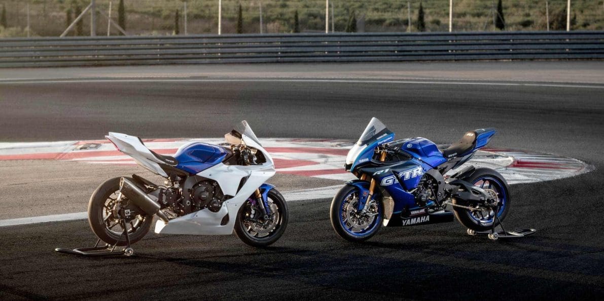 Two track-only motorcycles on a circuit.