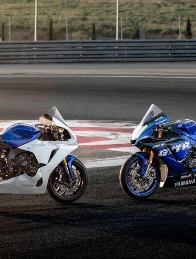 Two track-only motorcycles on a circuit.