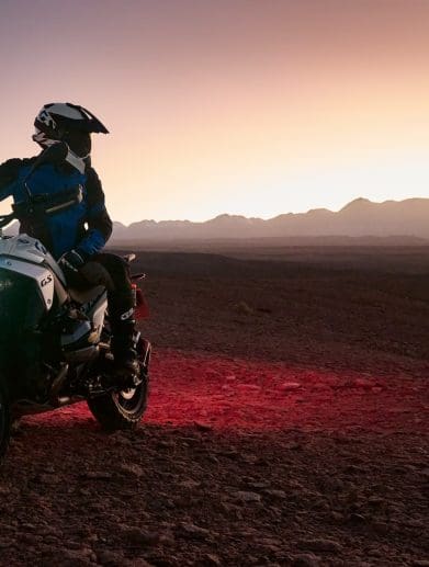 A rider on a BMW R 1300 GS in the desert.