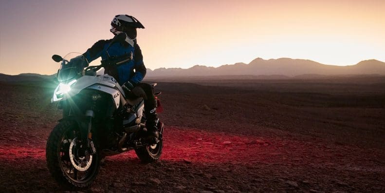 A rider on a BMW R 1300 GS in the desert.