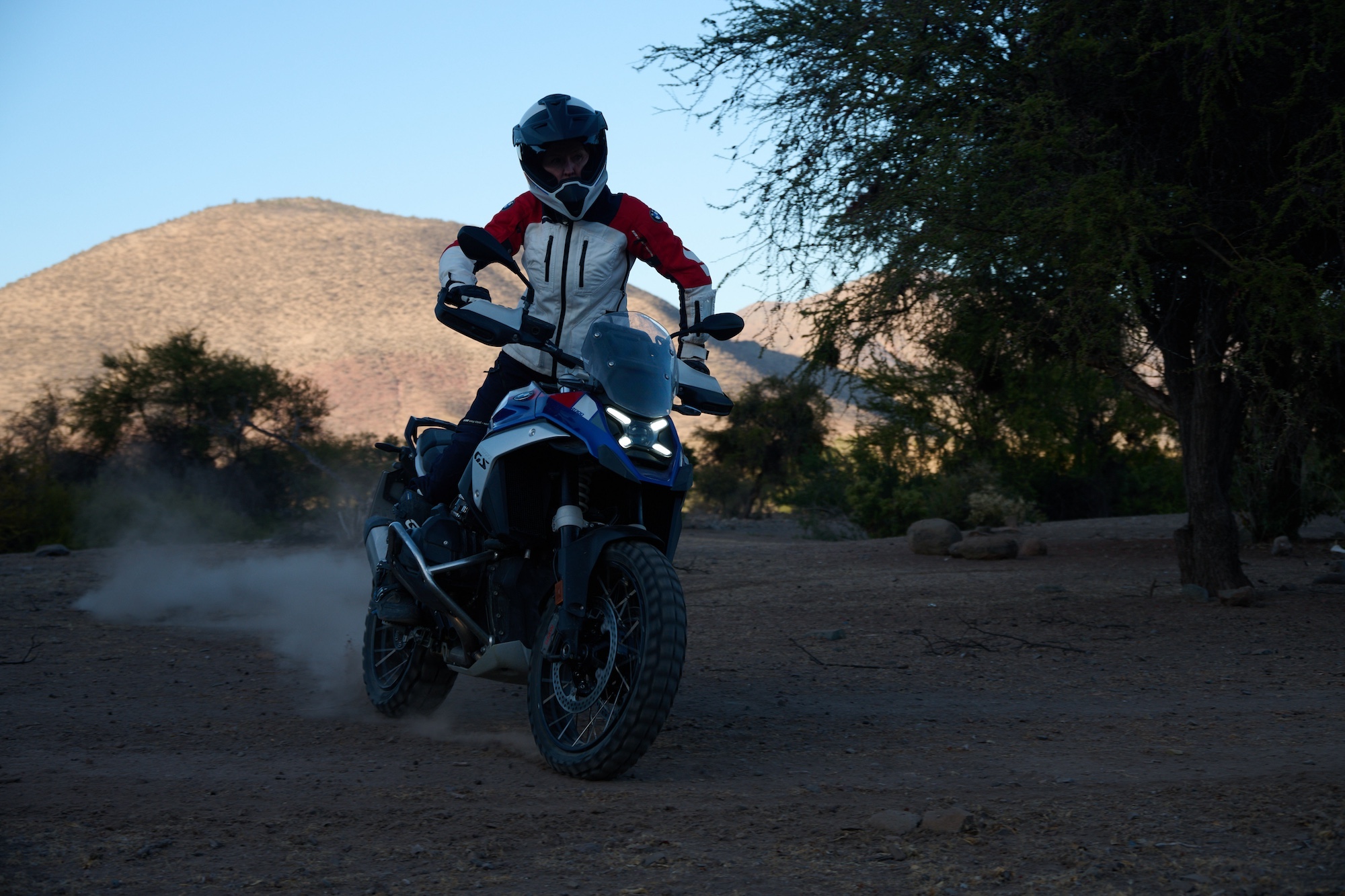 A rider on a BMW R 1300 GS in the desert.