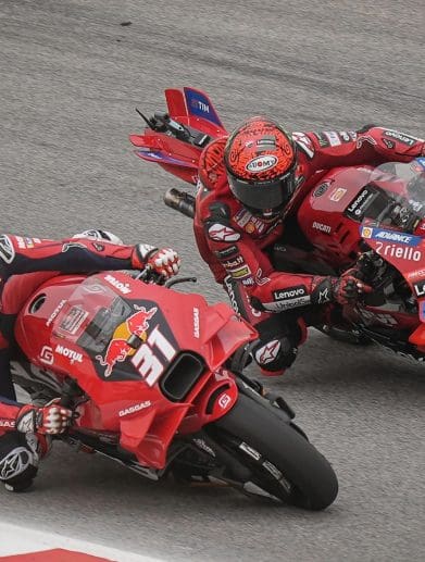 Two racers on the MotoGP circuit.