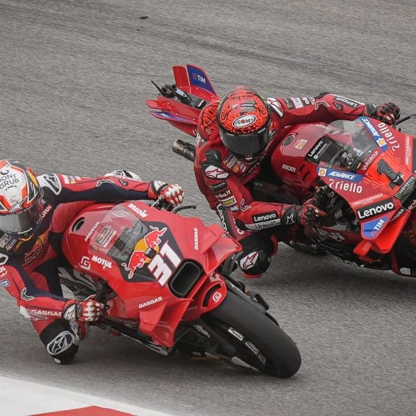 Two racers on the MotoGP circuit.