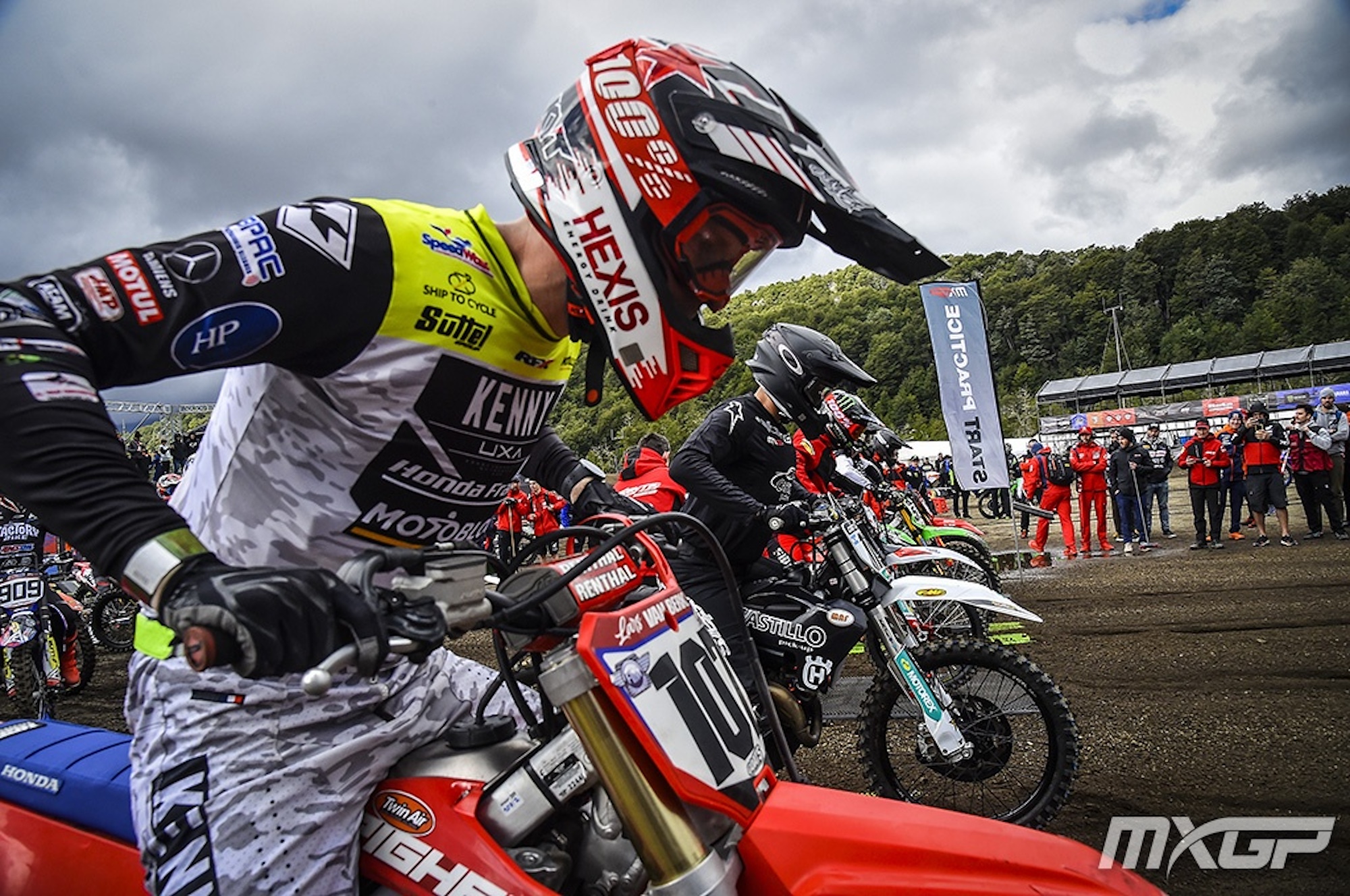 A motorcyclist getting ready to race.