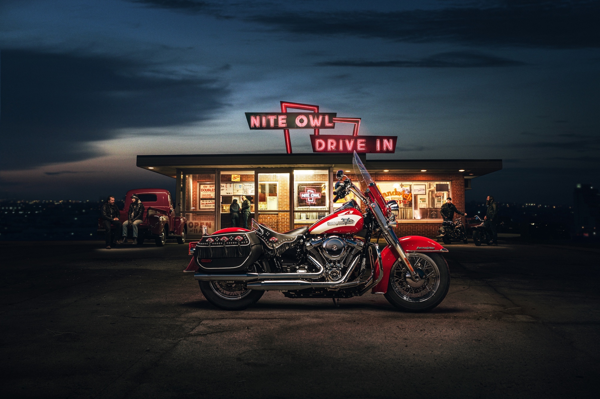 A Harley motorycle in front of a pub.