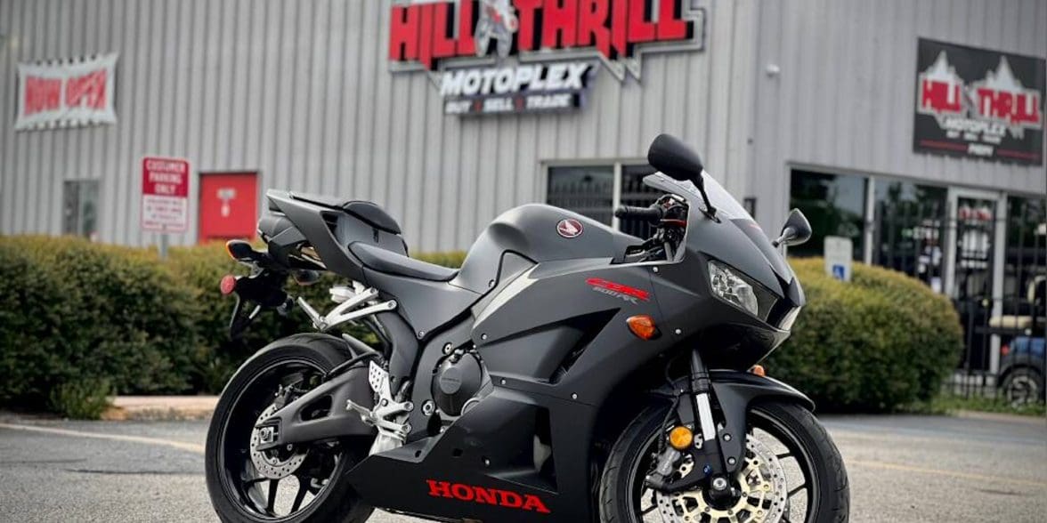 A Honda motorcycle in front of a dealership.