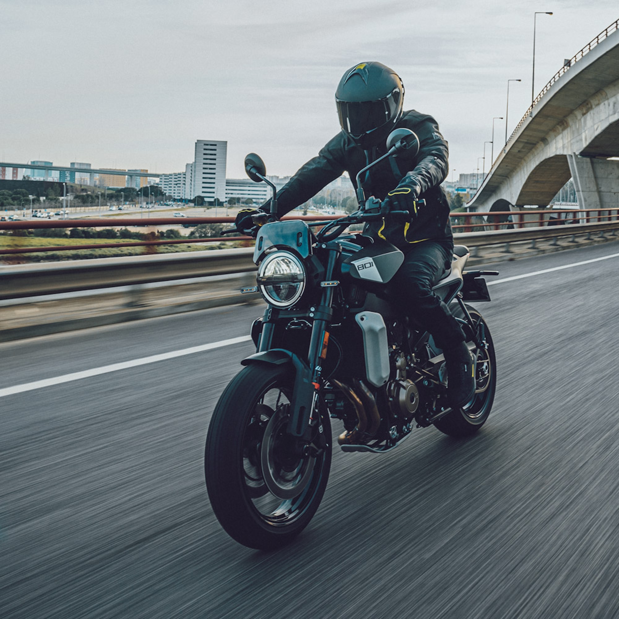 A motorcycle rider on the road.