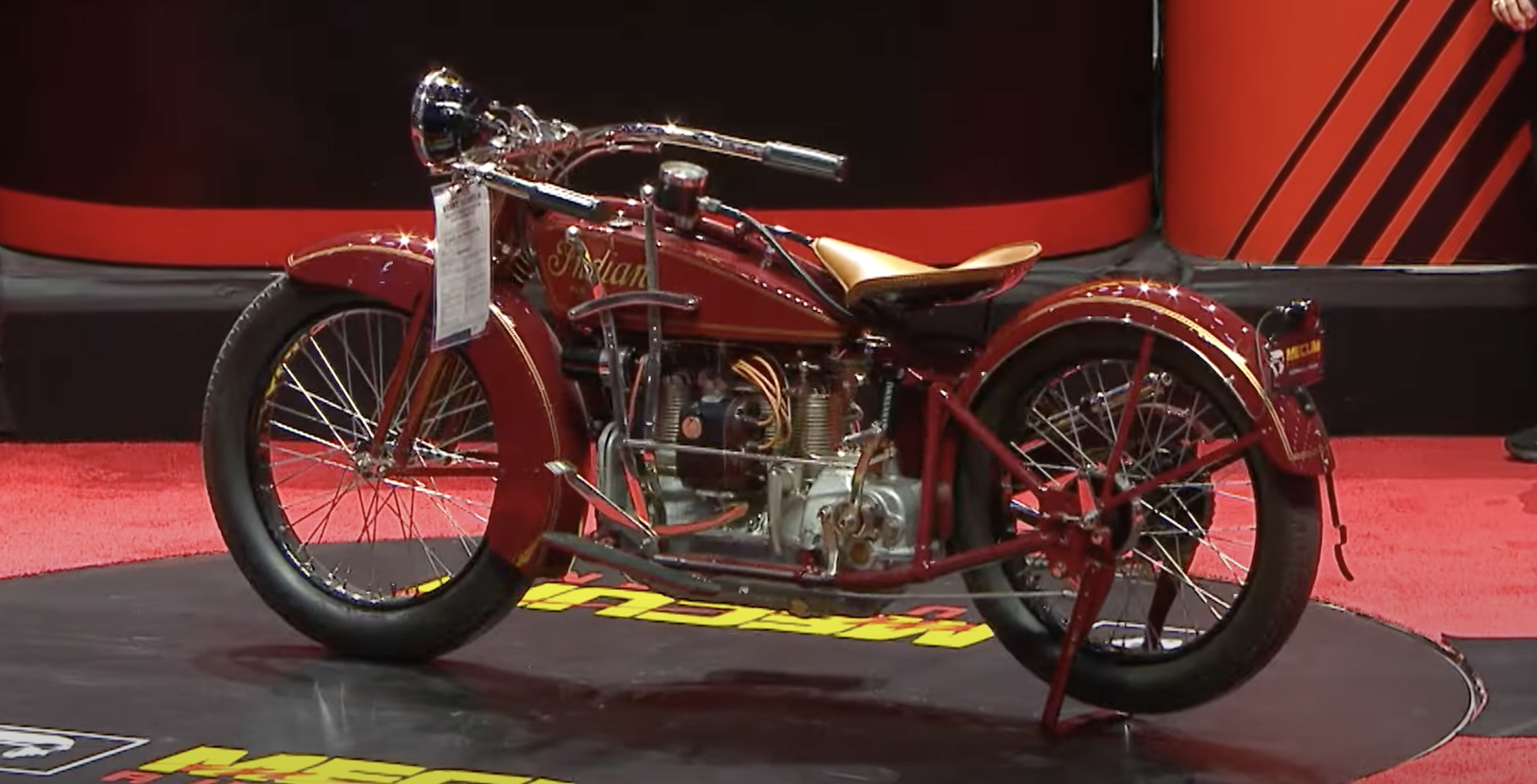 A side view of an antique motorcycle.