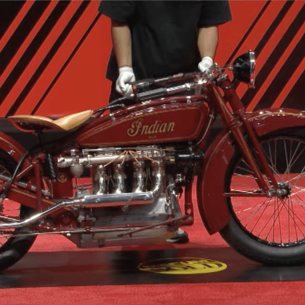 A side view of an antique motorcycle.