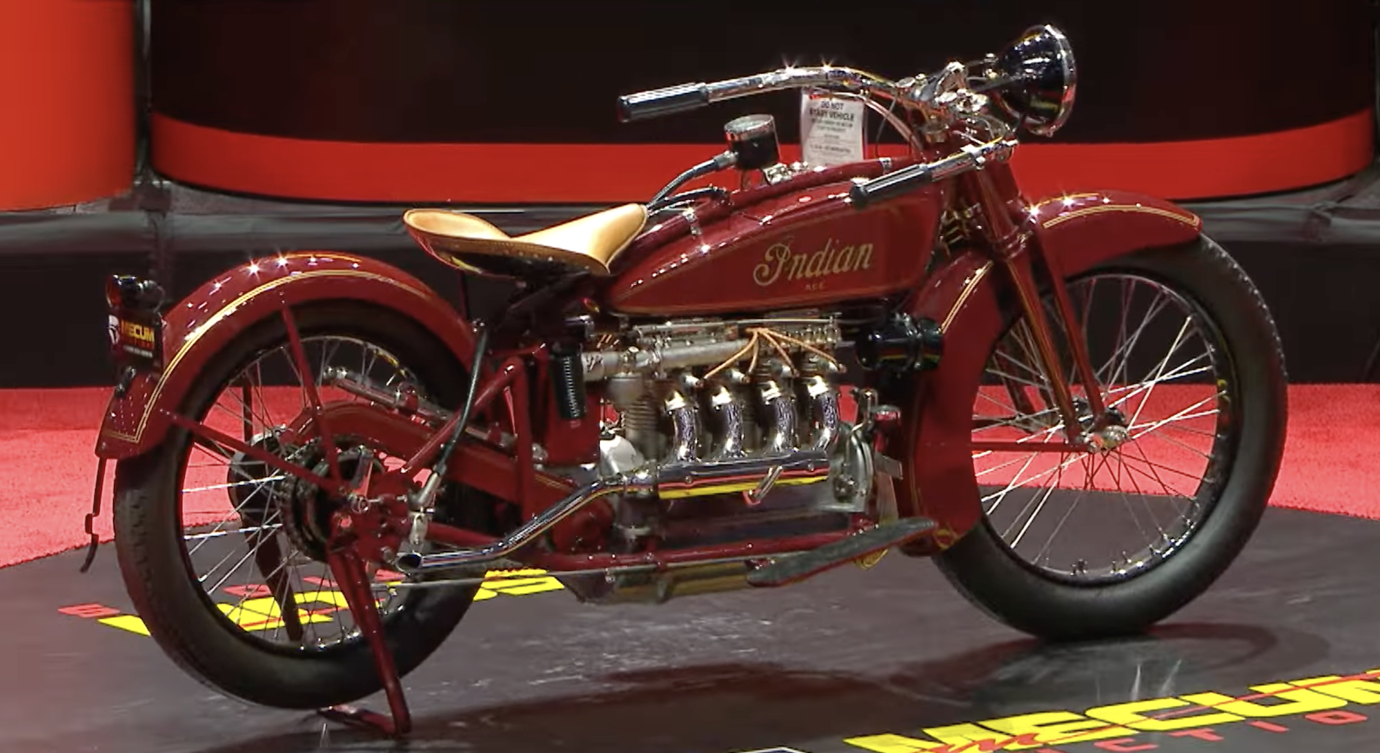 A side view of an antique motorcycle.