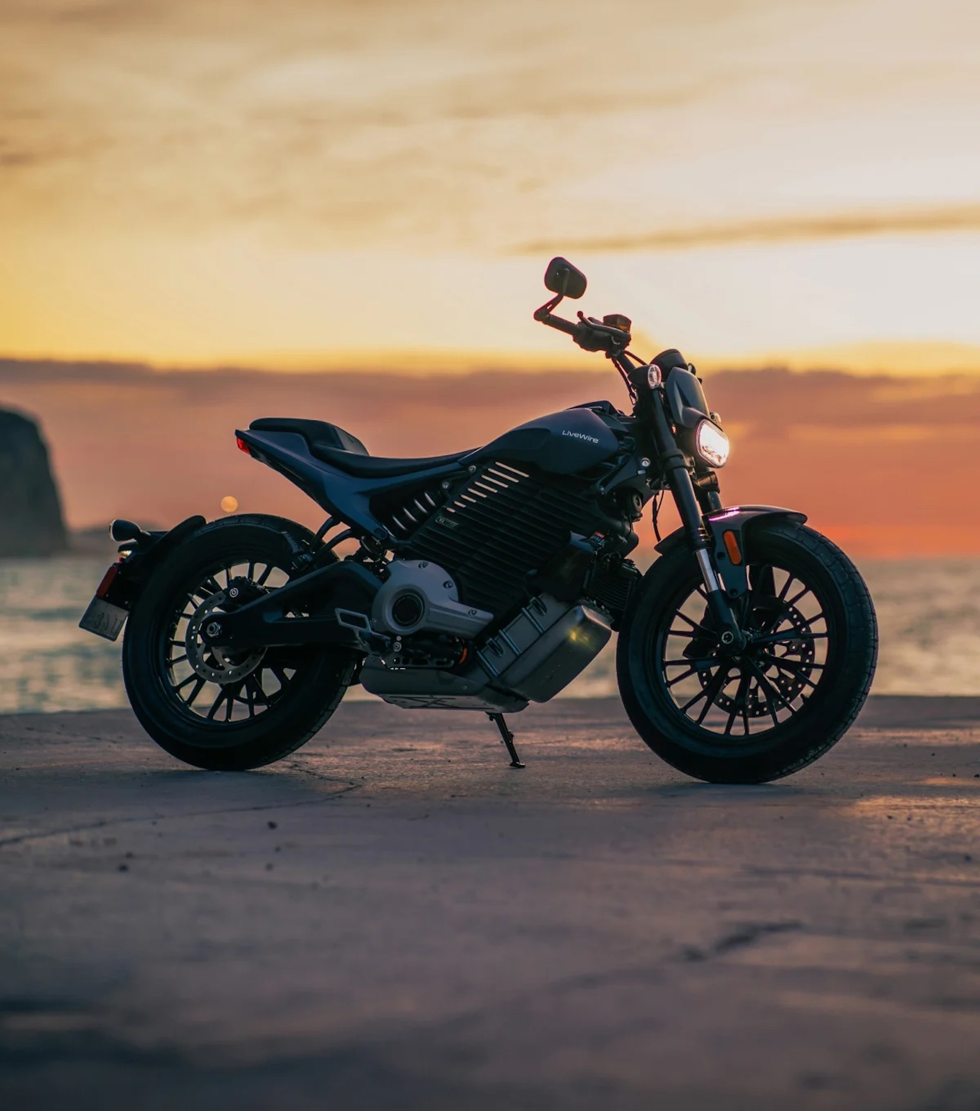 An electric motorcycle at the beach.