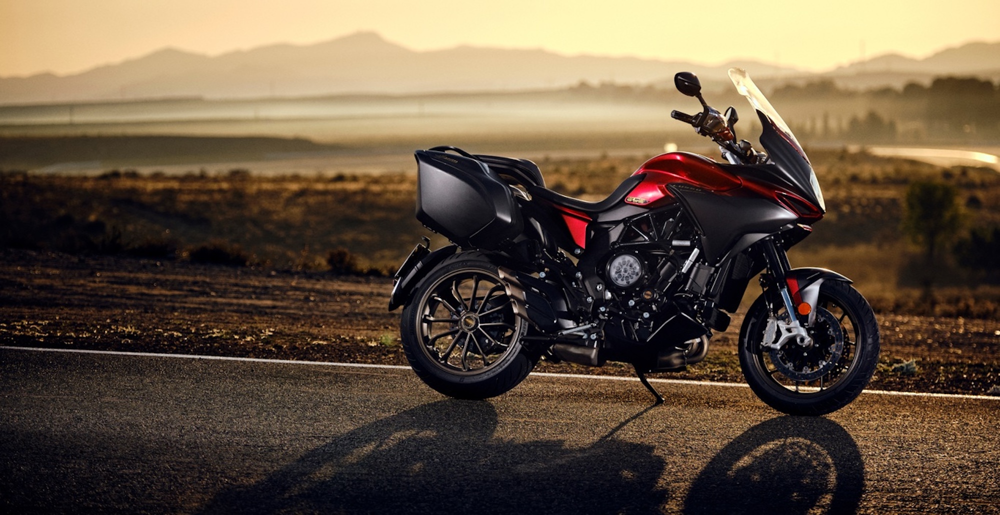 An adventure bike out on the road. 