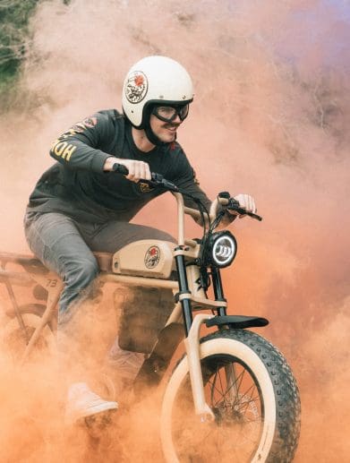 A guy riding an electric motorcycle.