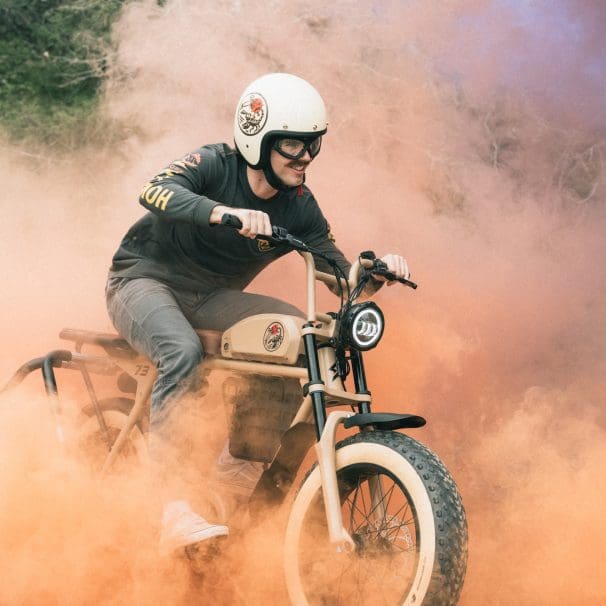 A guy riding an electric motorcycle.