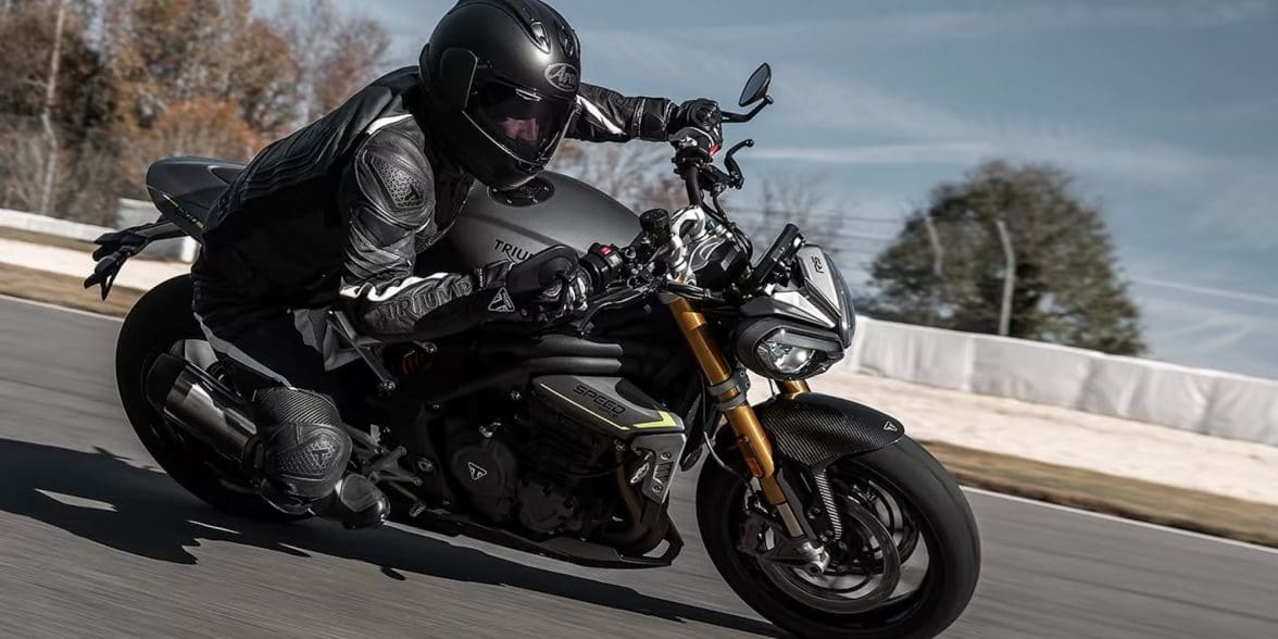 A motorcyclist leaning into a turn.