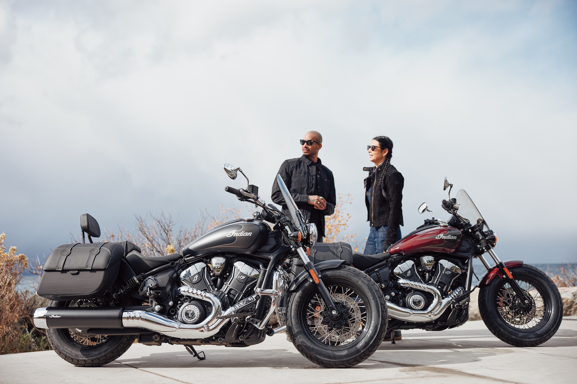 Two men behind an Indian Motorcycle duo.