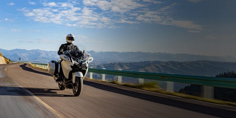 A man riding a motorcycle.