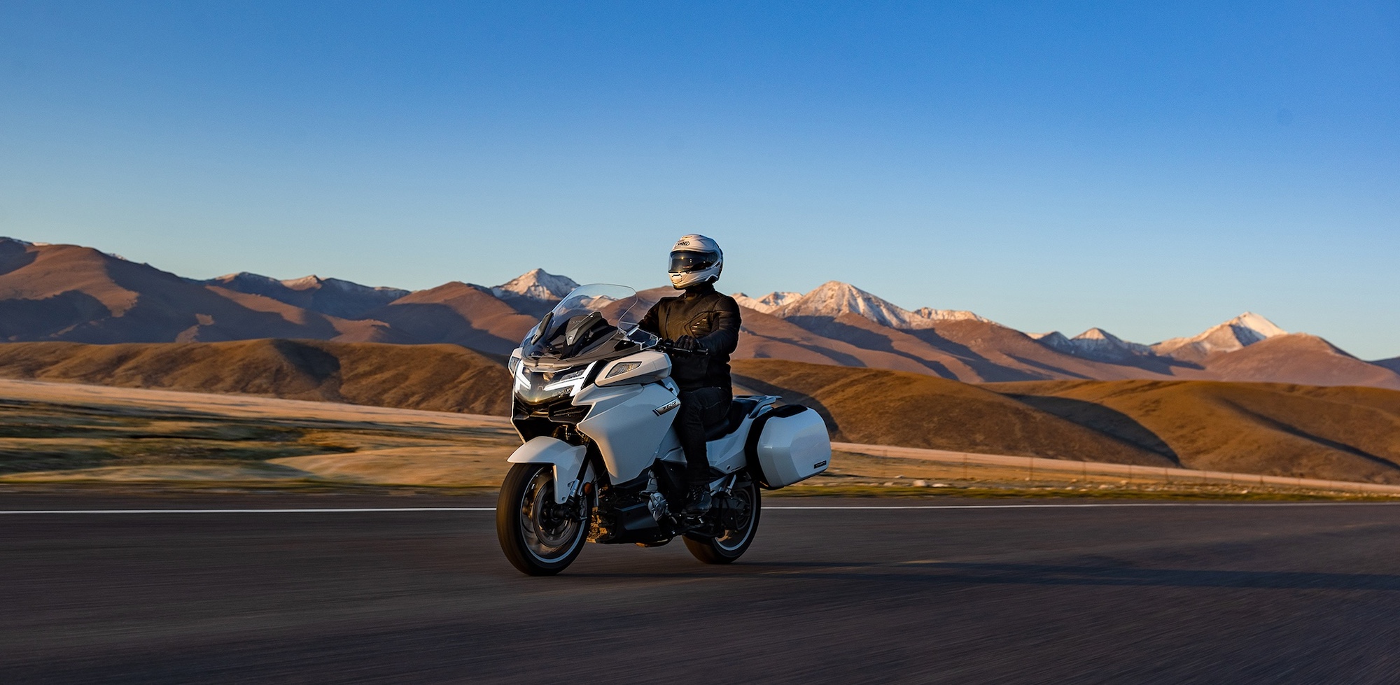 A man riding a motorcycle.