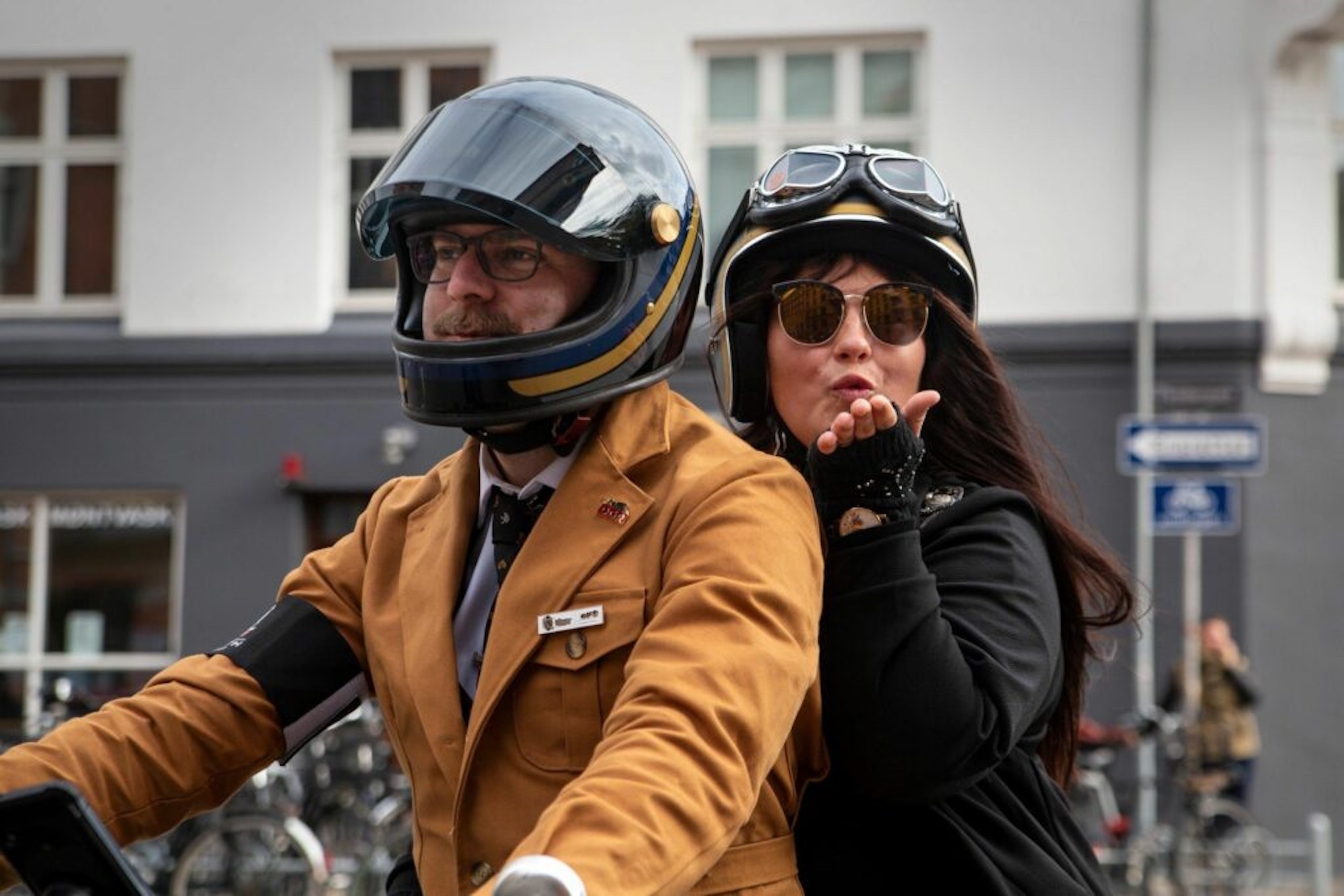 A man and a woman on a motorcycle.