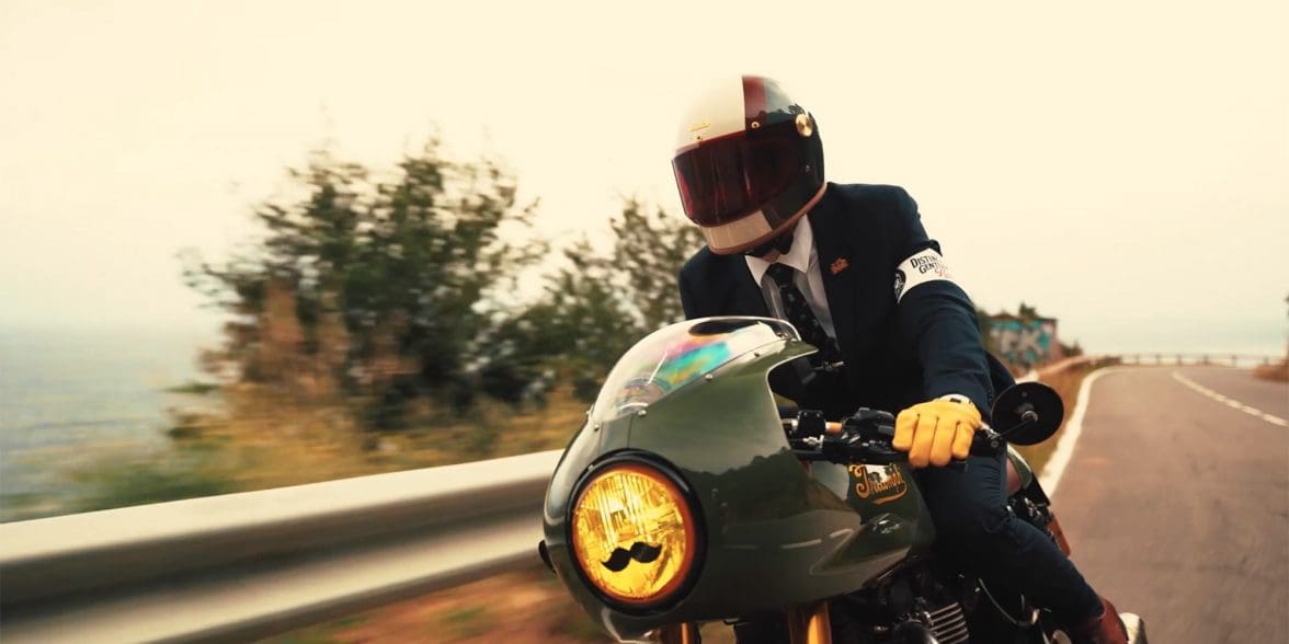 A view of a dapper-dressed gentleman riding for a cause with the Distinguished Gentleman's Ride.