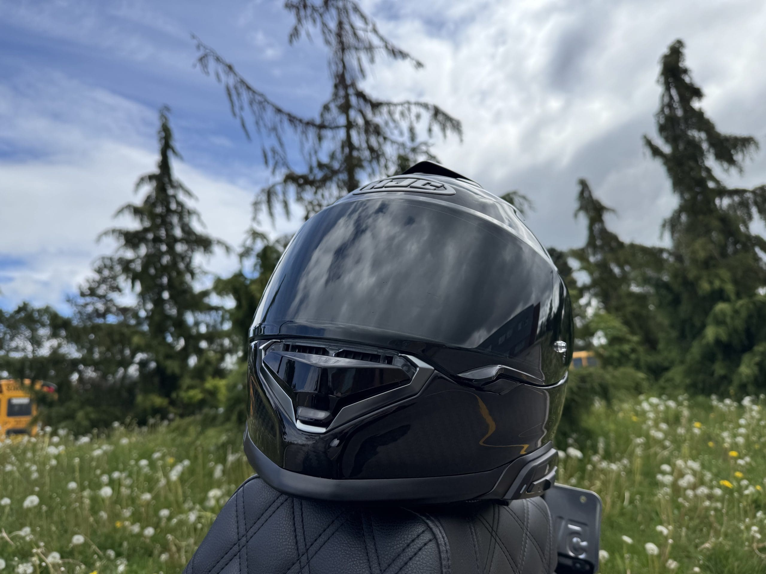 HJC RPHA 71 Carbon Helmet resting on a Harley Davidson seat