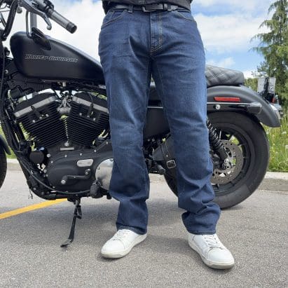 Rider wearing the K Forty 2 Stretch Denim Jeans in front of a black Harley Davidson