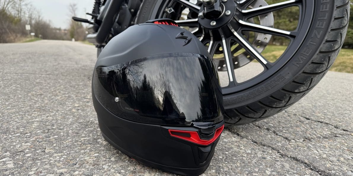 Scorpion EXO-Eclipse resting next to a motorcycle tire