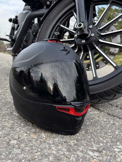 Scorpion EXO-Eclipse resting next to a motorcycle tire