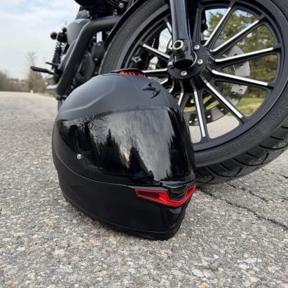 Scorpion EXO-Eclipse resting next to a motorcycle tire