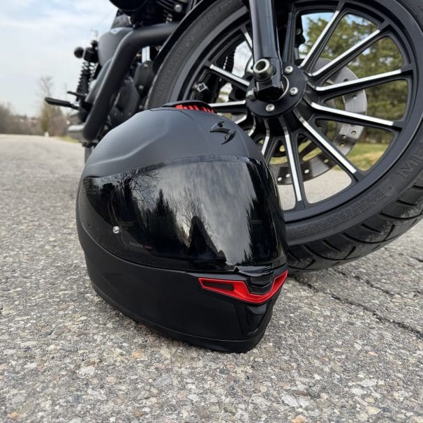 Scorpion EXO-Eclipse resting next to a motorcycle tire