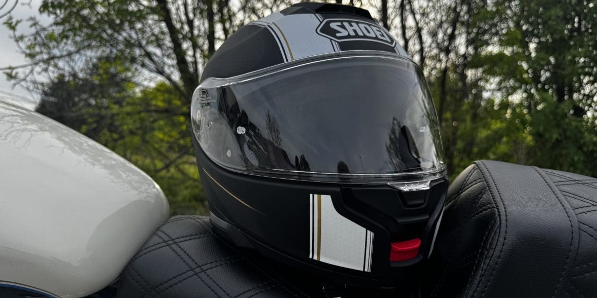 Shoei Neotec 3 Satori TC-5 Helmet resting on saddlemen seat of harley davidson sportster 883