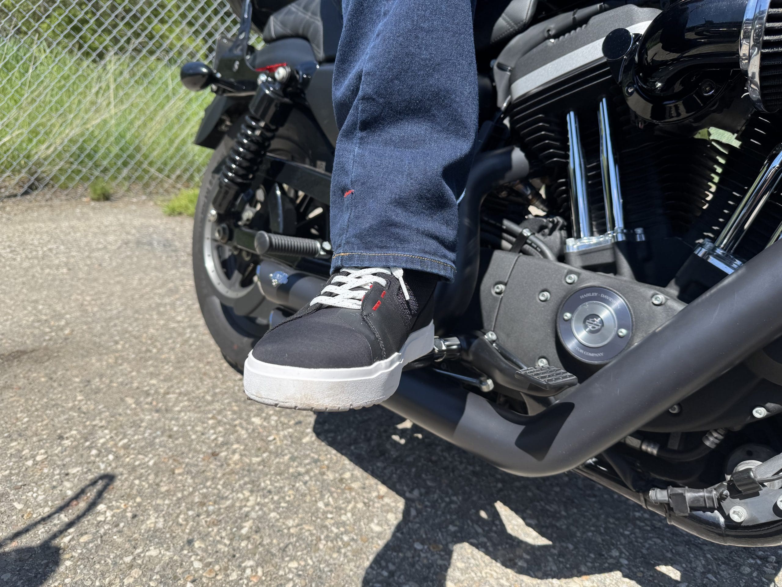 Sidi ARX Air Riding Shoes on the foot peg of a Harley Davidson