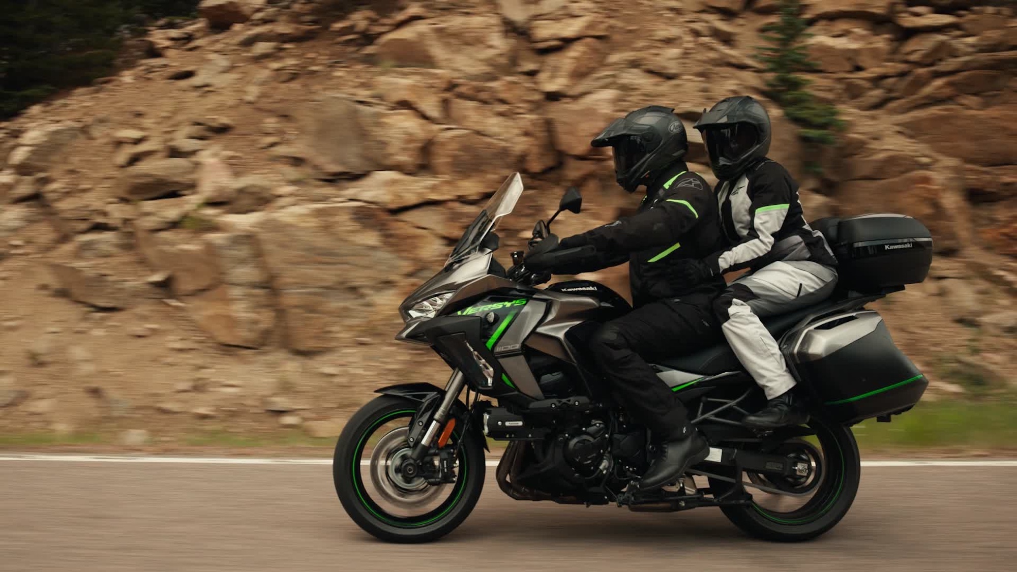 A view of a Kawasaki Versys motorcycle with two riders.
