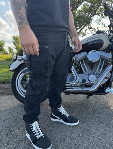 Pando Moto Desert Cargo pants standing beside motorcycle