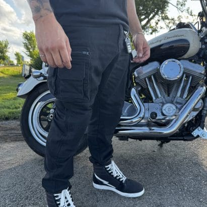 Pando Moto Desert Cargo pants standing beside motorcycle