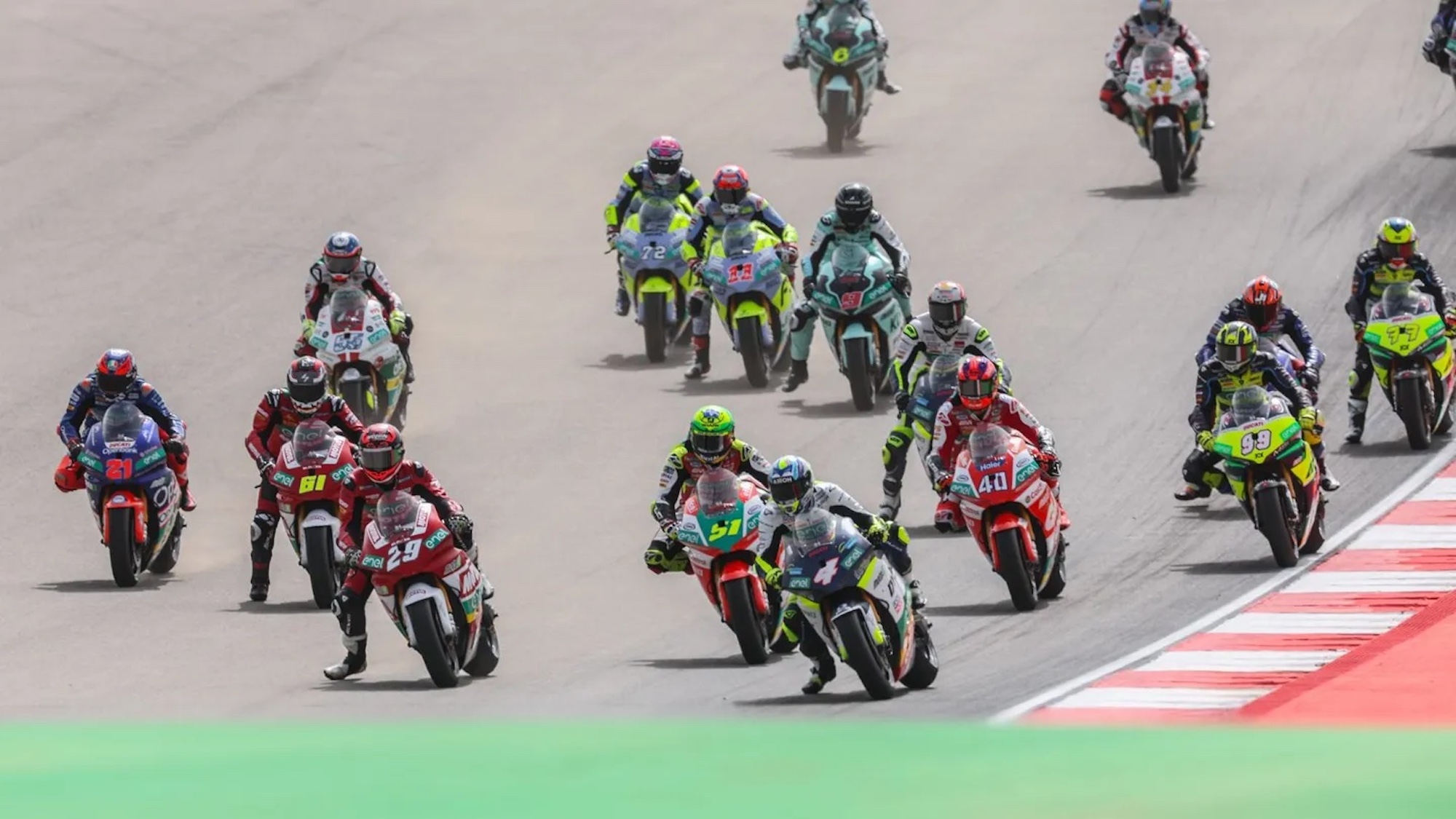 A view of Motogp riders on the racetrack.