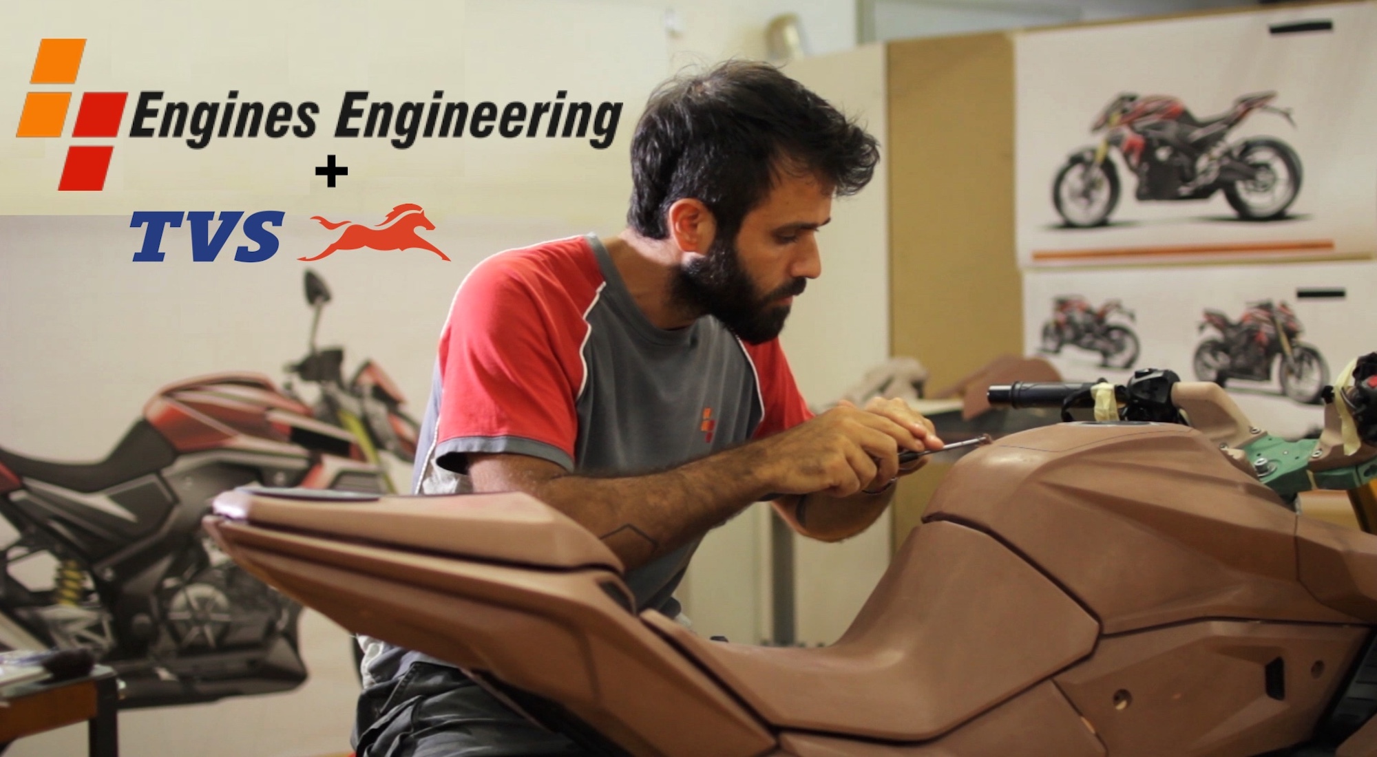 An EE worker crafting a clay bike prototype. 