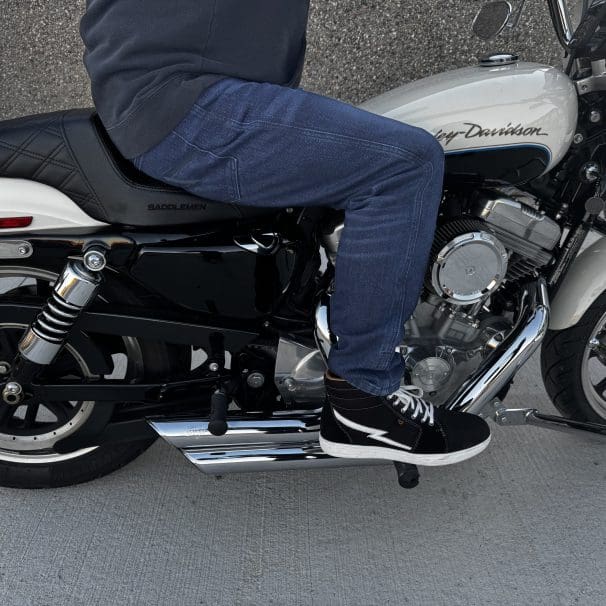Pando Moto Arnie Slim Blue Jeans worn while sitting on motorcycle