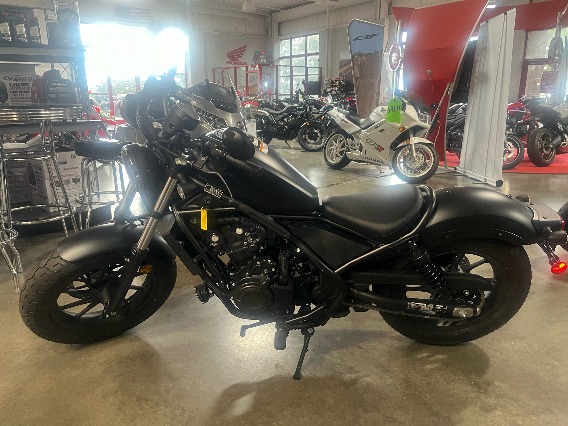 Side view of a 2025 black Honda Rebel motorcycle